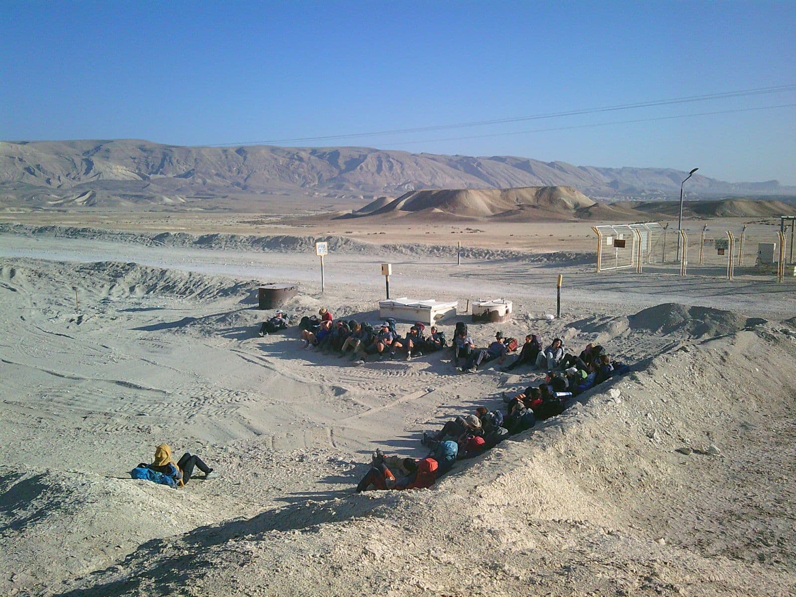 The journey's desert night camp — sleeping bags in a circle, from above